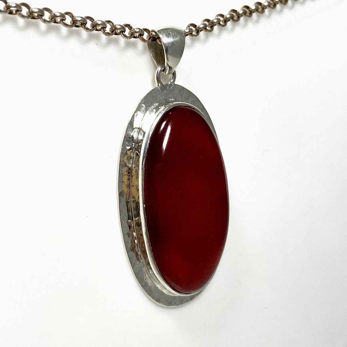 Carnelian Oval pendant in a decorative hammered setting KPGJ4580