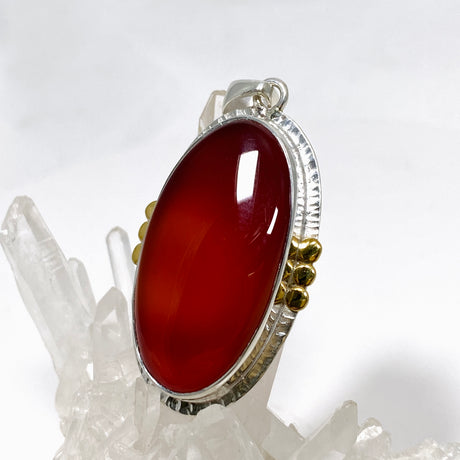 Carnelian Oval pendant with a brass decorative setting KPGJ4581