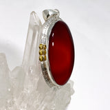 Carnelian Oval pendant with a brass decorative setting KPGJ4581