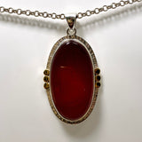 Carnelian Oval pendant with a brass decorative setting KPGJ4581