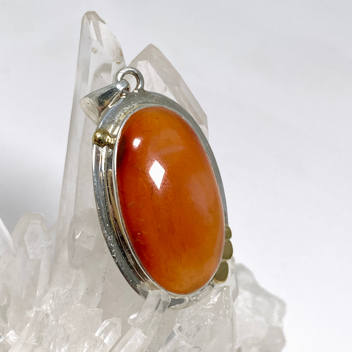 Carnelian Oval pendant with a brass decorative setting KPGJ4582