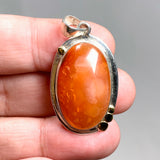 Carnelian Oval pendant with a brass decorative setting KPGJ4582