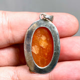 Carnelian Oval pendant with a brass decorative setting KPGJ4582