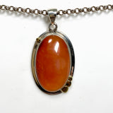 Carnelian Oval pendant with a brass decorative setting KPGJ4582