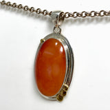 Carnelian Oval pendant with a brass decorative setting KPGJ4582