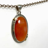 Carnelian Oval pendant with a brass decorative setting KPGJ4582