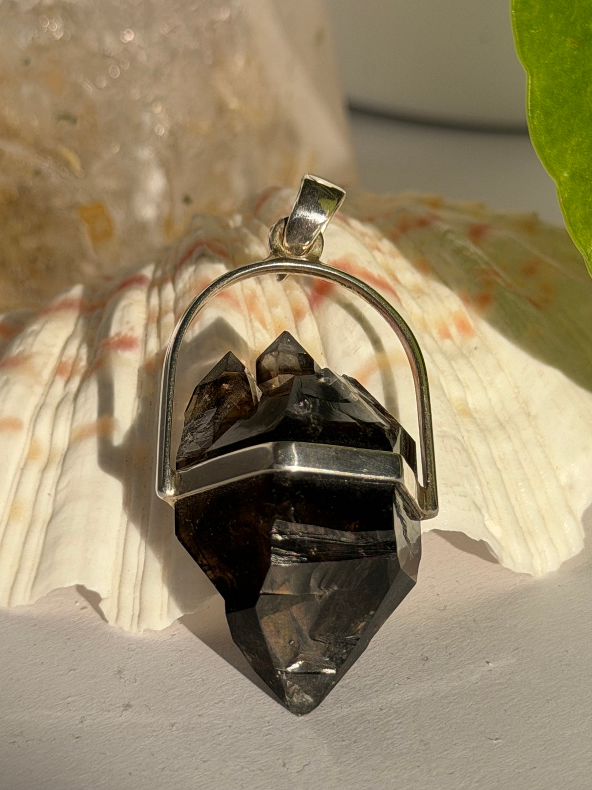 Multiple terminations on one end of Mooralla Smokey Quartz Double Terminated Crystal set into silver pendant