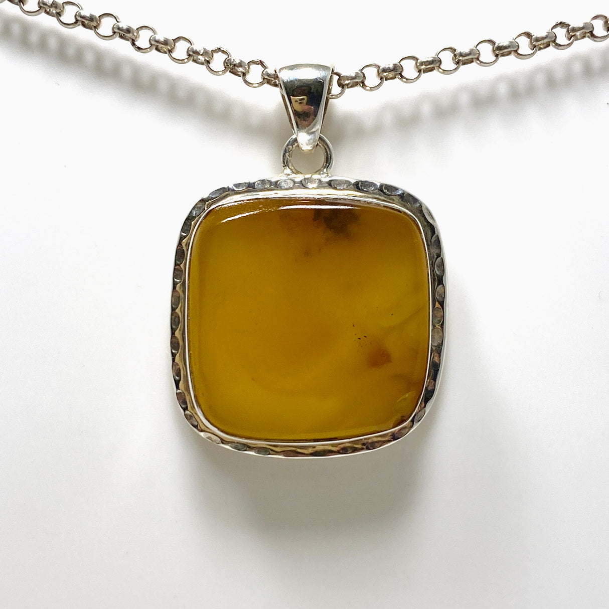 Natural Amber Square Pendant in a Hammered Setting KPGJ4339