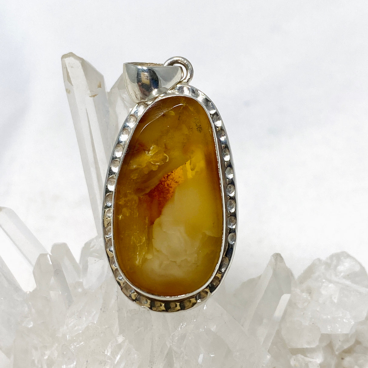 Natural Amber Teardrop Pendant in a Hammered Setting KPGJ4340