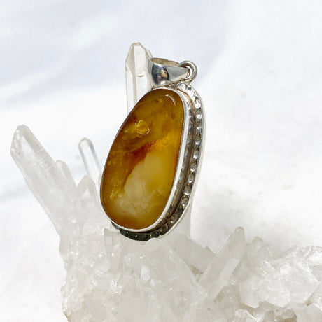 Natural Amber Teardrop Pendant in a Hammered Setting KPGJ4340