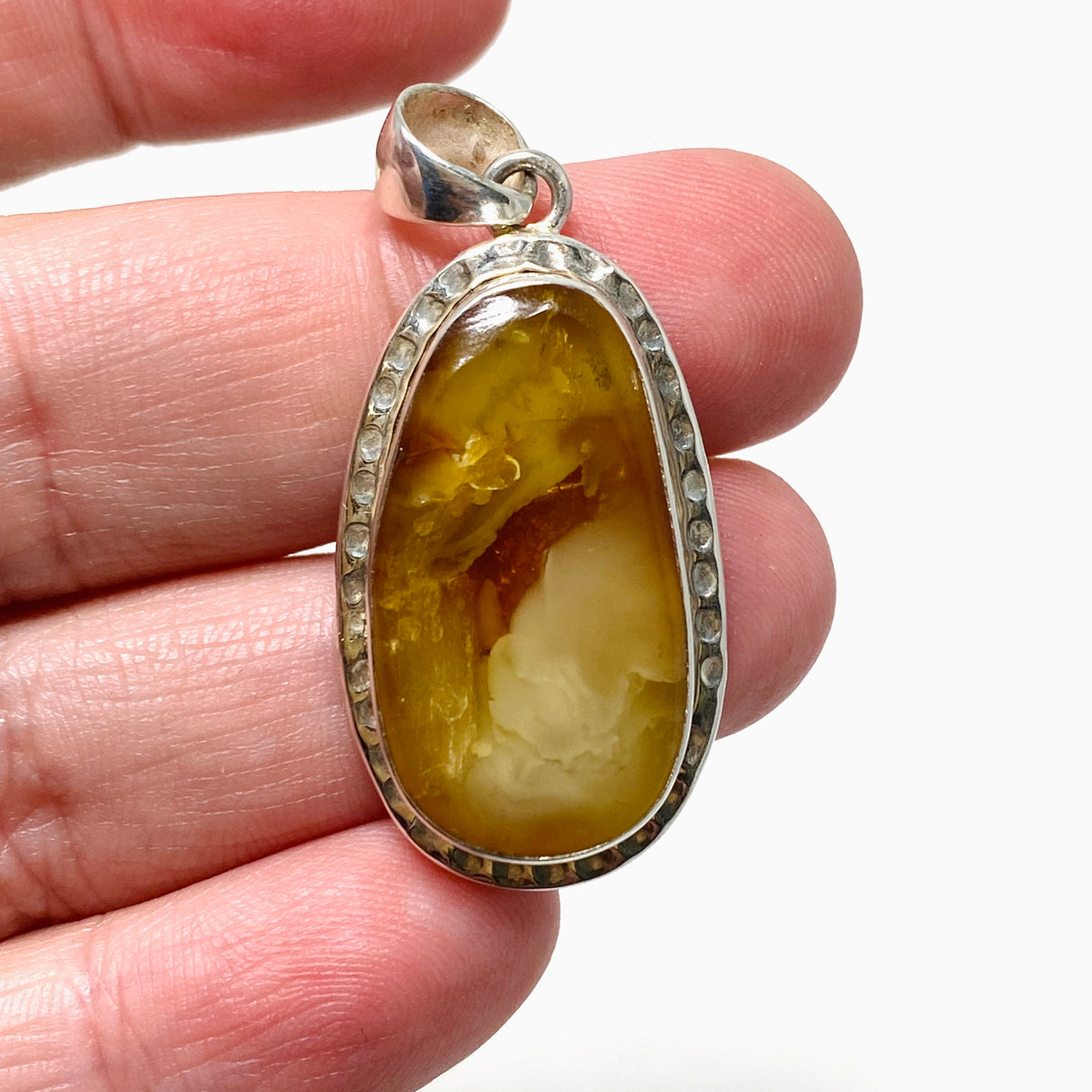 Natural Amber Teardrop Pendant in a Hammered Setting KPGJ4340