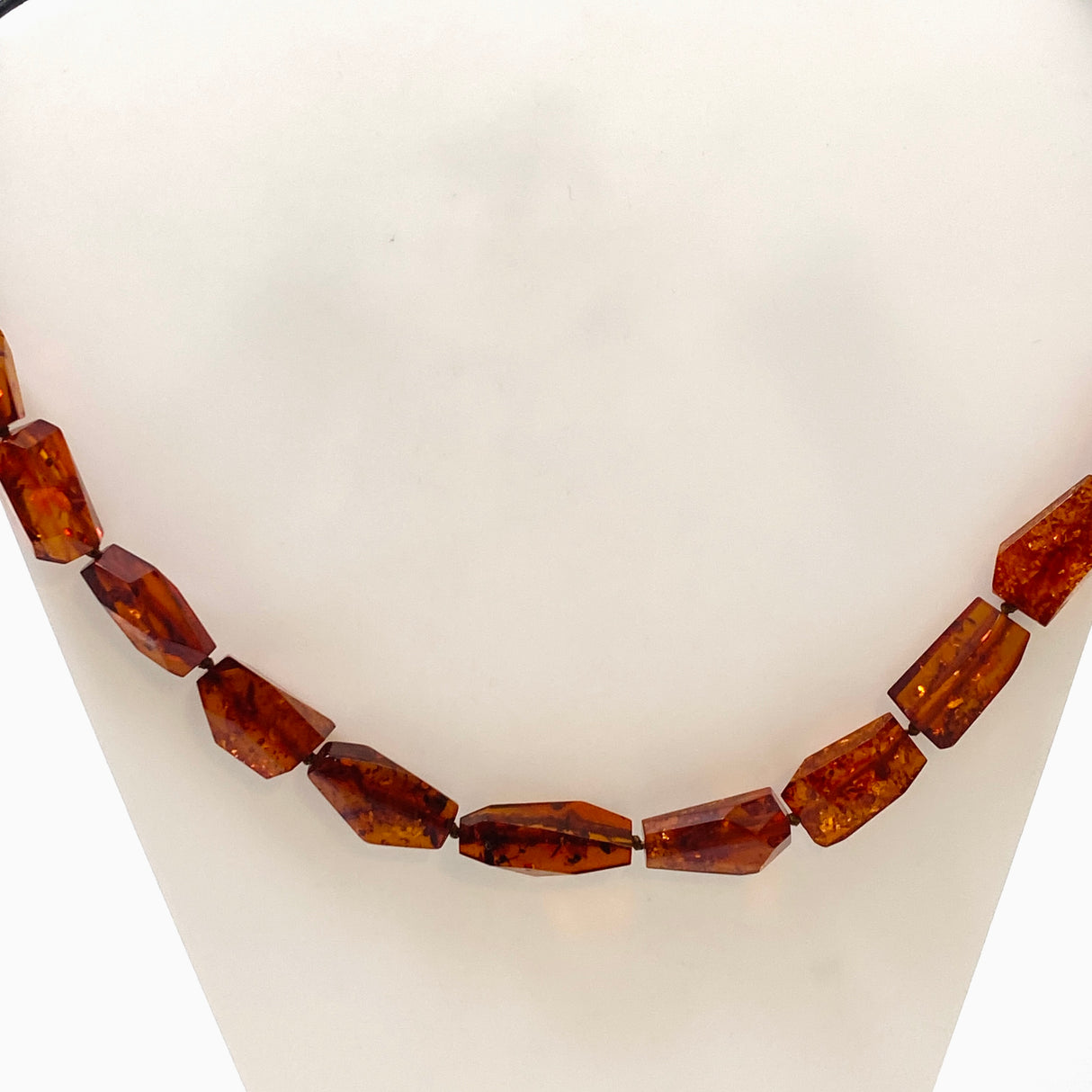 Baltic Amber Cognac beaded necklace on black leather AMB308