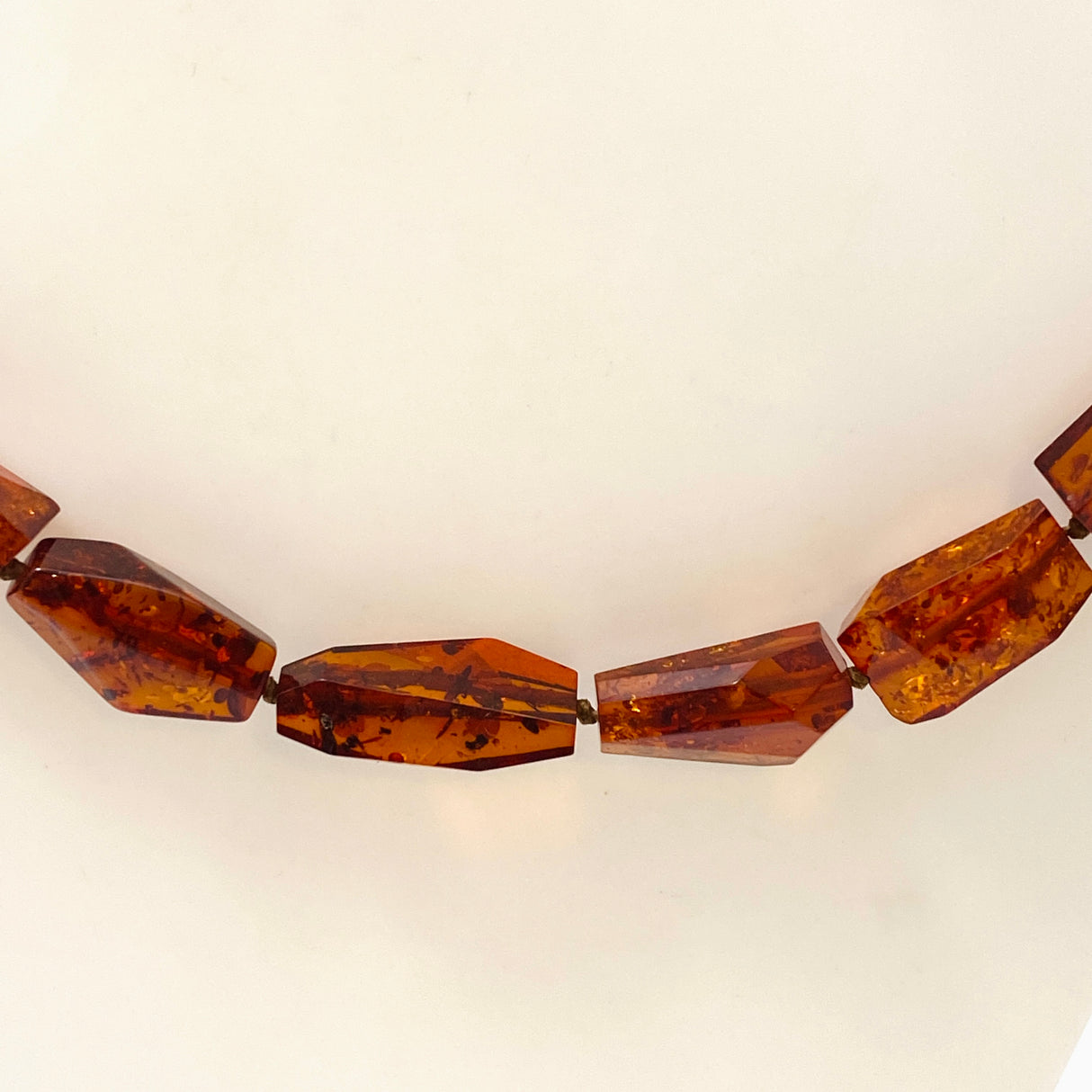 Baltic Amber Cognac beaded necklace on black leather AMB308