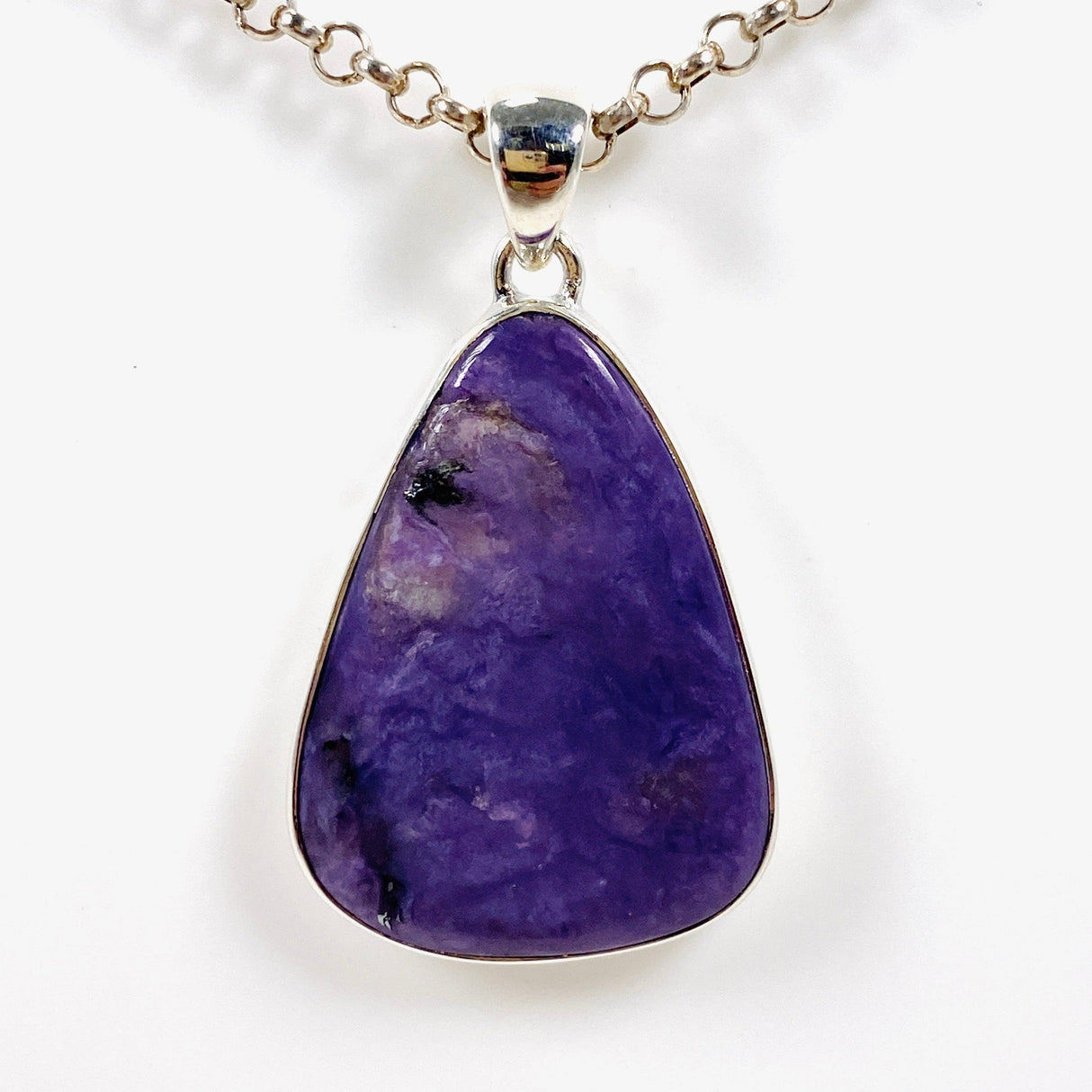 Purple Charoite tear drop pendant in sterling silver on a chain
