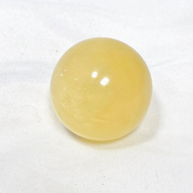 Honey Calcite Sphere 120-130g - Nature's Magick