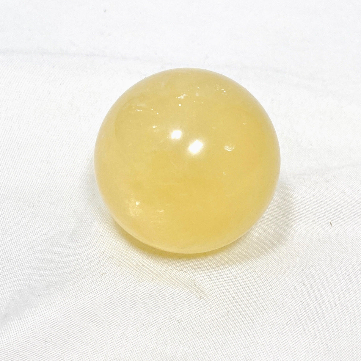 Honey Calcite Sphere 120-130g - Nature's Magick