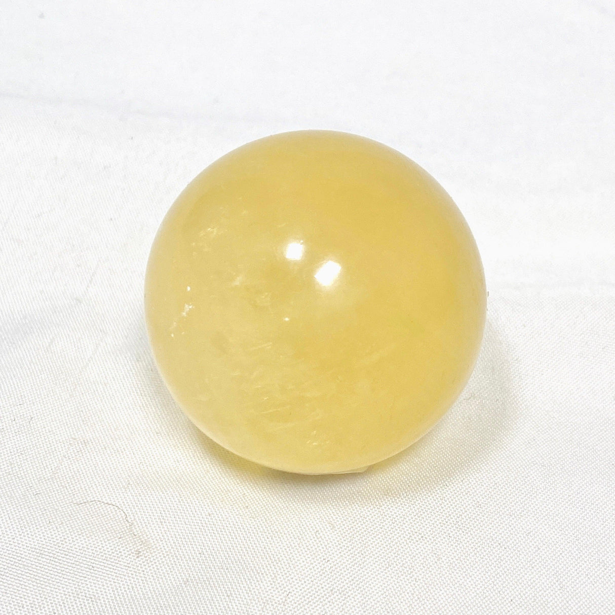Honey Calcite Sphere 120-130g - Nature's Magick