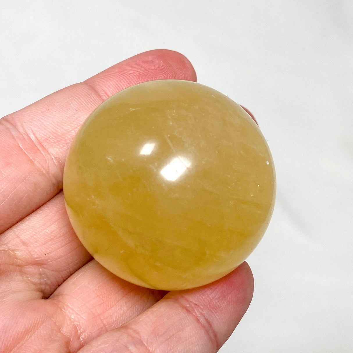 Honey Calcite Sphere 120-130g - Nature's Magick