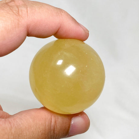 Honey Calcite Sphere 120-130g - Nature's Magick