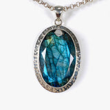 Blue iridescent Labradorite faceted gemstone and silver pendant on a chain