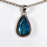 Blue iridescent Labradorite faceted gemstone pendant set in silver on a silver belcher chain