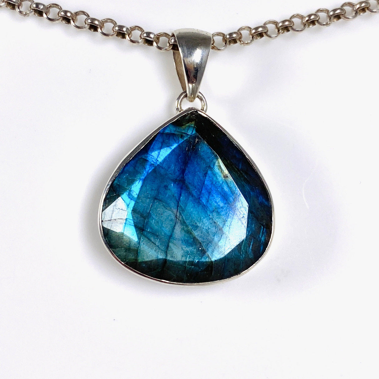 Blue iridescent Labradorite faceted gemstone and silver pendant on a chain