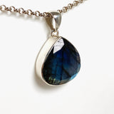Blue iridescent Labradorite faceted gemstone and silver pendant on a chainl