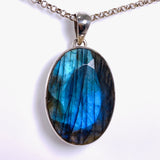 Blue iridescent Labradorite faceted gemstone and silver pendant on a chain