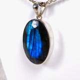 Blue iridescent Labradorite faceted gemstone and silver pendant on a chain