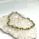 Peridot faceted oval gemstone in 925 silver crown setting bracelet PBGJ032