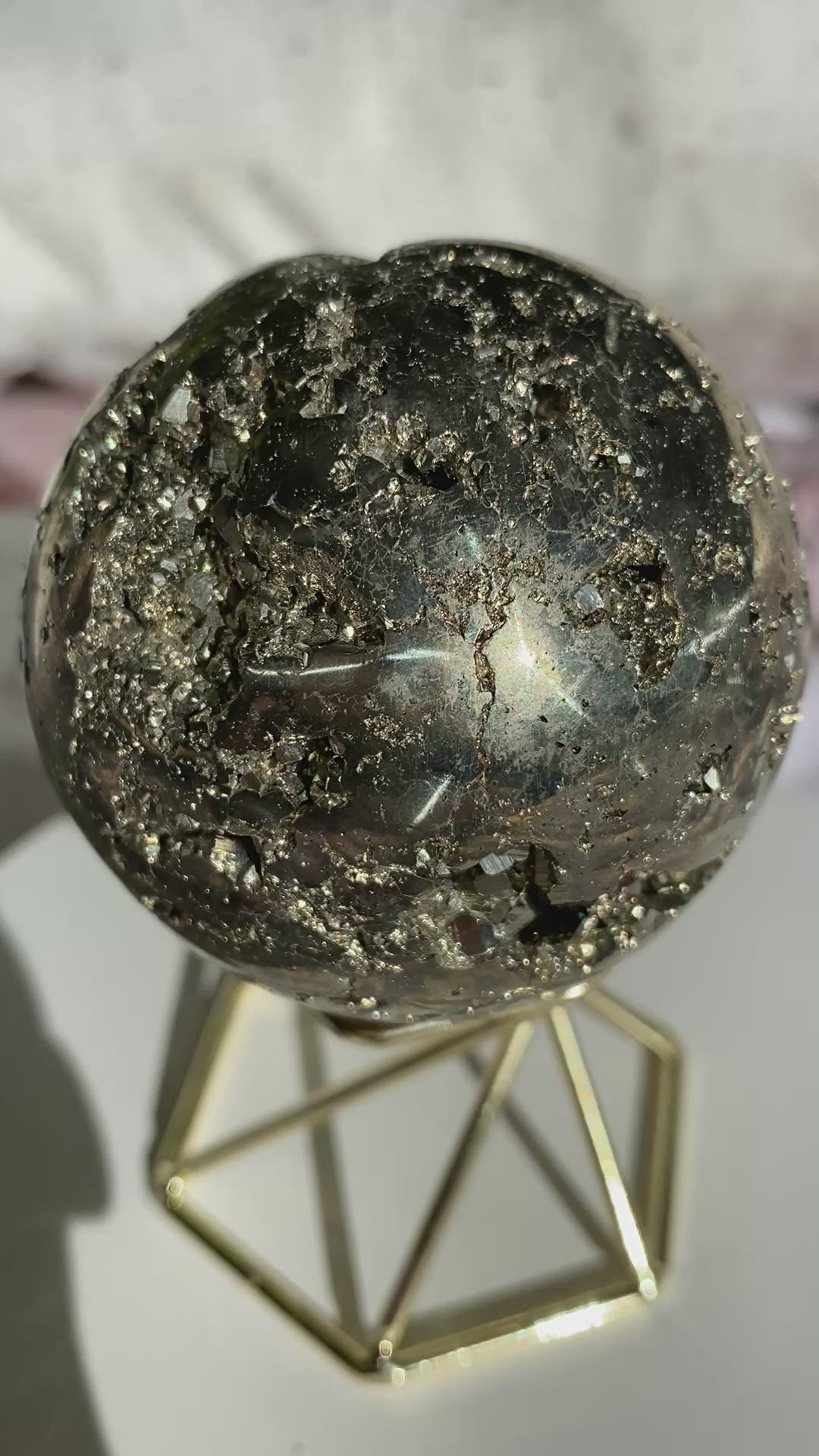 Pyrite sphere sparkling in the sun