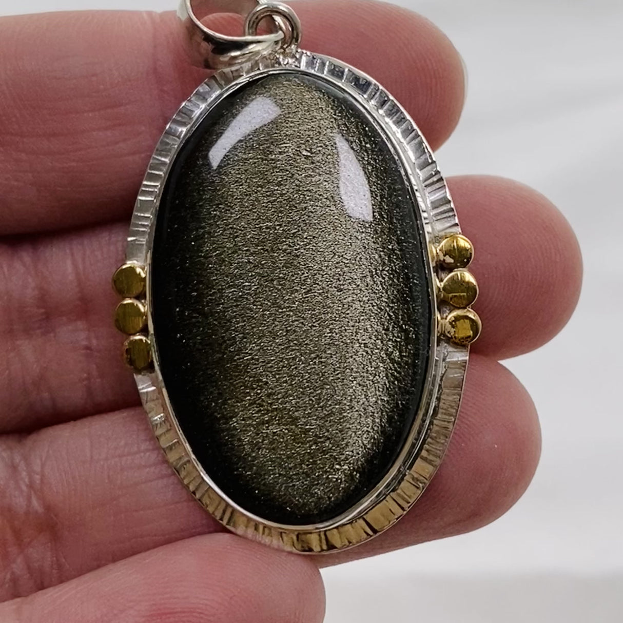 Goldsheen Obsidian Oval Cabochon Pendant in a Decorative Setting KPGJ4758