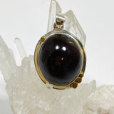 Star Garnet Oval Cabochon Pendant in a Decorative Setting KPGJ4848