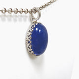 Tanzanite Oval Cabochon Pendant in a Decorative Setting HPGJ-10