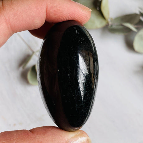 Black tourmaline palmstone 100-150g BTP-L - Nature's Magick